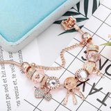 Roze Dromenvanger Armband met Inclusief Zilveren Charms