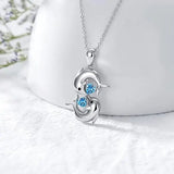 Zilveren Collier met Dubbele Dolfijnen en Blauwe Kristal