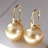 Elegante gouden oorbellen met parels